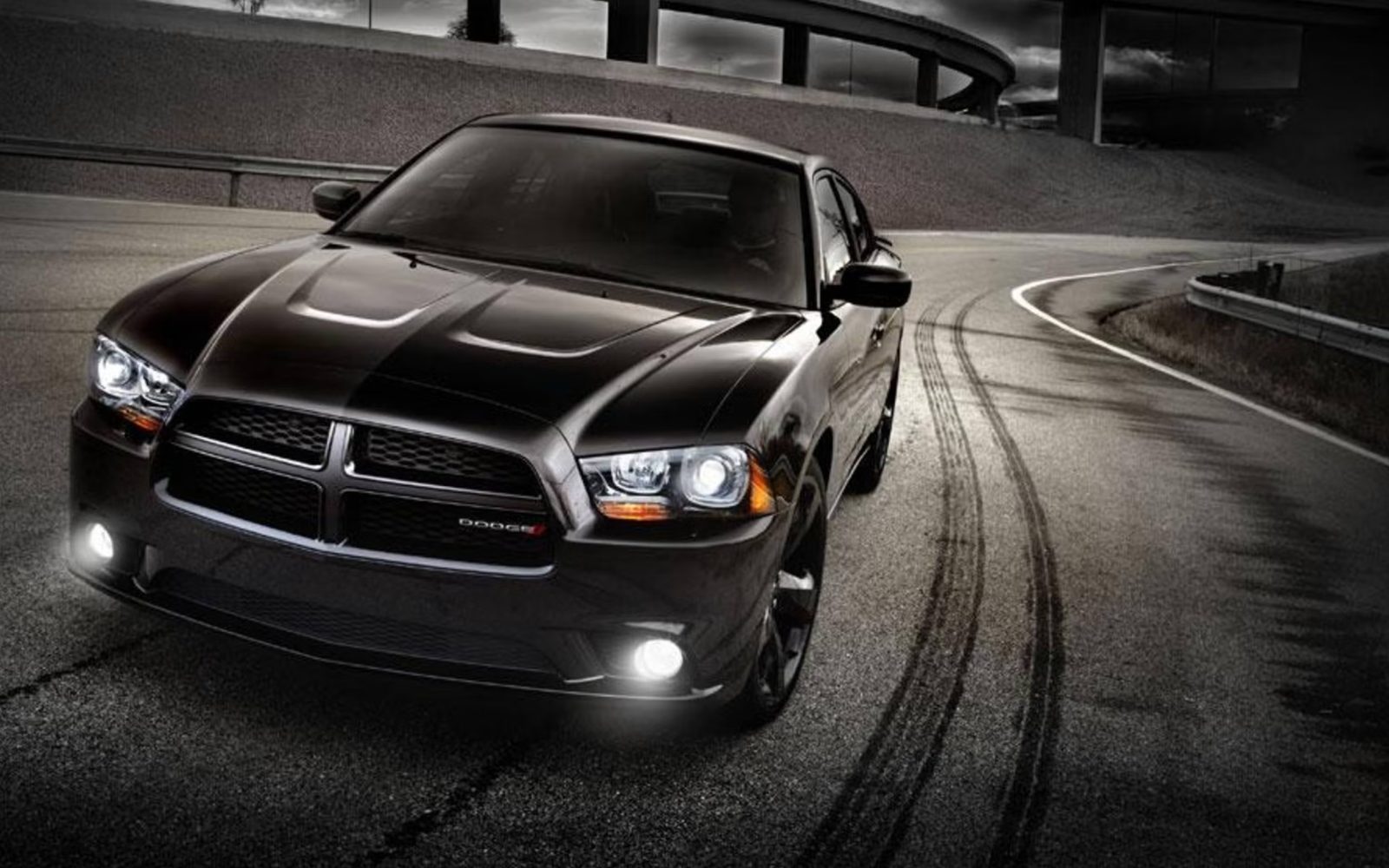 Blacked-out Dodge Charger on a test track at night